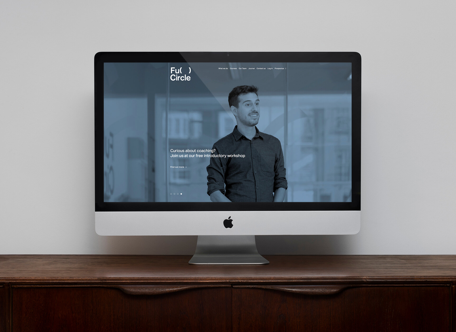 The Full Circle website shown on an iMac screen.